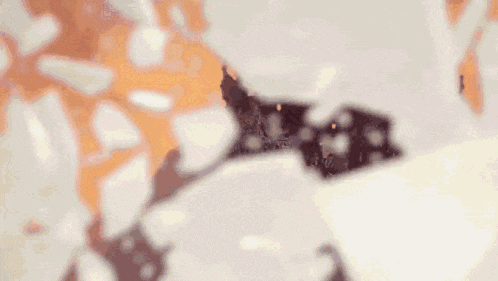 a close up of a black crown on a white surface