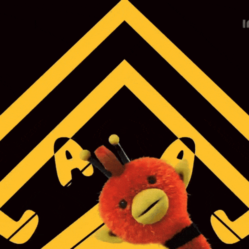 two stuffed animals are standing in front of a yellow and black sign that says a