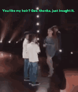 a blurred image of a woman talking to another woman with the caption " you like my hair ? gea thanks just bought it "
