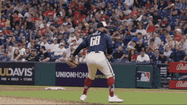 a baseball player with the number 68 on his jersey stands on the field