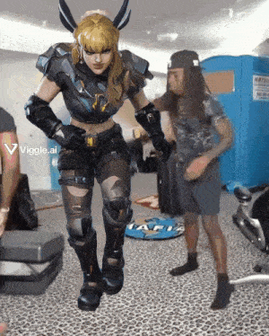 a woman in a video game costume is dancing in front of a man with long hair