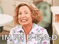 a woman is smiling and laughing with the words `` im fn d-e-a-d '' .