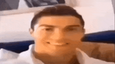 a close up of a man 's face with a smile on it .