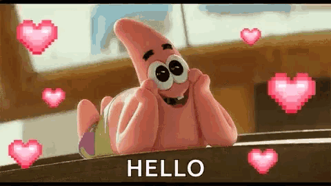 patrick star from spongebob squarepants is laying on a table with hearts around him and says hello .