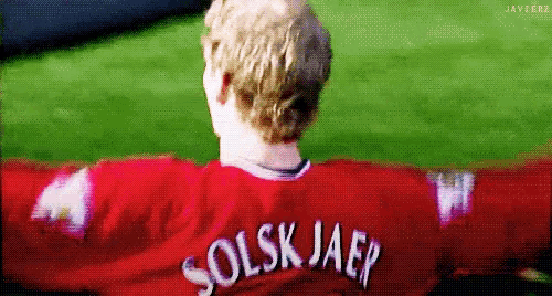 a man in a red shirt with the name solsk jaep on it