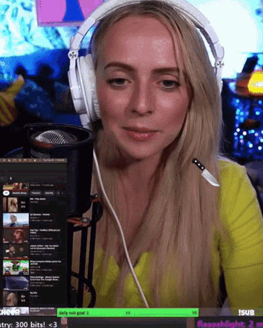a woman wearing headphones is looking at a screen that says 300 bits on it