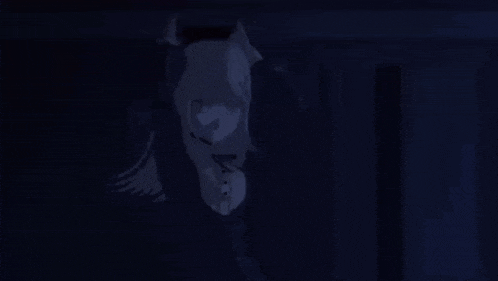 a close up of a person 's face with a dark background