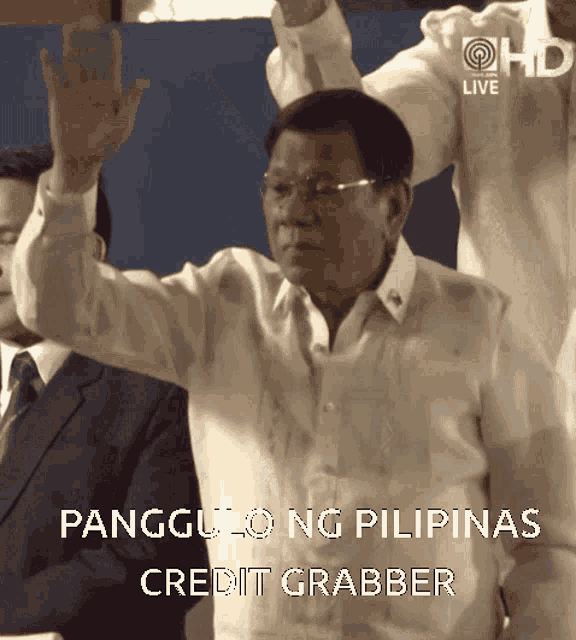 a man in a white shirt is raising his hands in the air with the caption pangulong ng pilipinas credit grabber