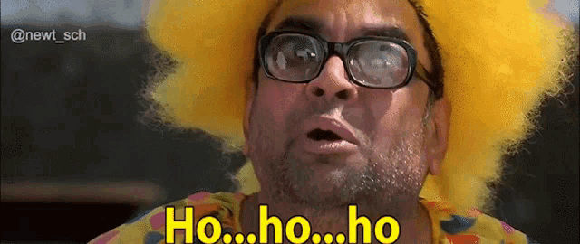a man wearing glasses and a yellow wig is saying ho ho ho .
