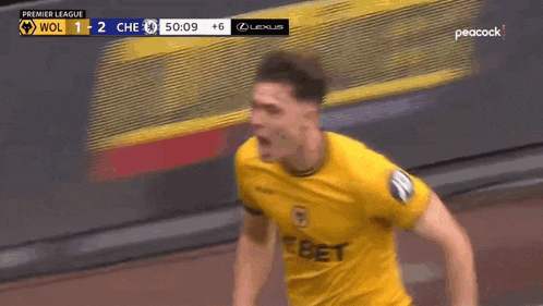 a soccer player wearing a yellow jersey that says debet