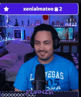 a man wearing headphones and a blue shirt with vegas 05 on it