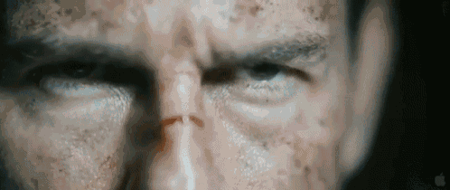 a close up of a man 's face with dirt on it