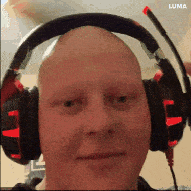 a close up of a man wearing headphones with luma written on the bottom