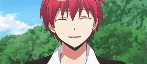 a close up of a person 's face with red hair making a funny face .