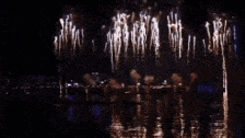 a fireworks display with a red thumbs up