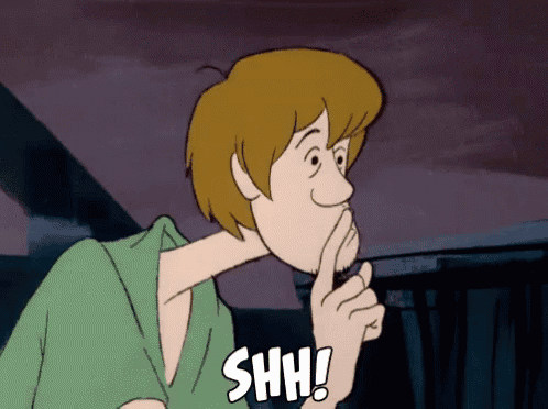 a cartoon character holds his finger to his mouth and says " shh "