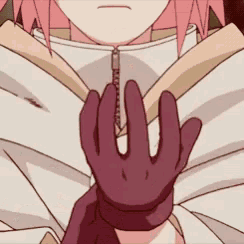 a close up of a person 's hands wearing gloves .