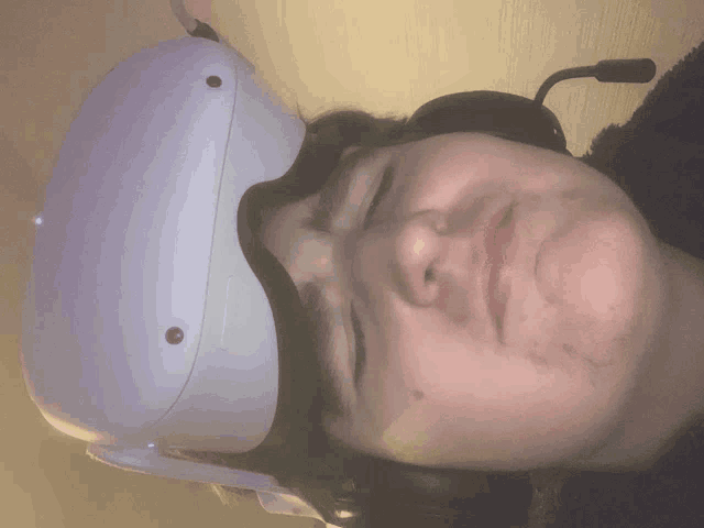 a person wearing a white virtual reality headset