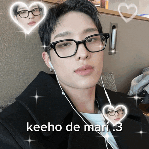 a man wearing glasses and ear buds is surrounded by hearts and the words keeho de mari .3