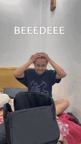 a person sitting on a bed with their hands on their head and the words beedeee above them