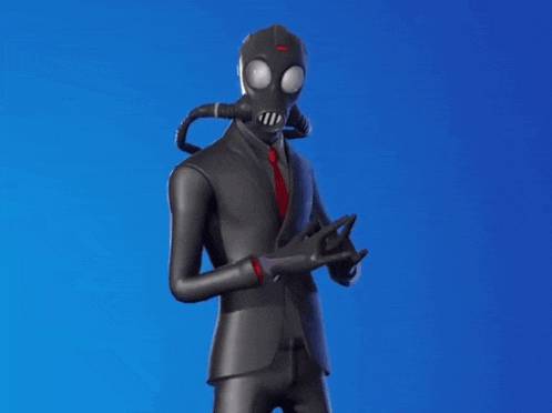 a man in a suit and gas mask is standing with his hands in his pockets