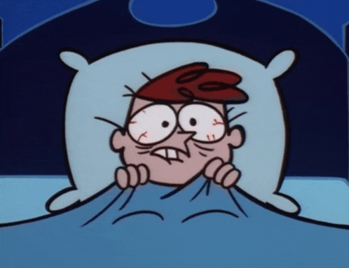a cartoon character is laying in bed with a pillow on his head
