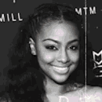 a black and white photo of a smiling woman with the words will mtm behind her .