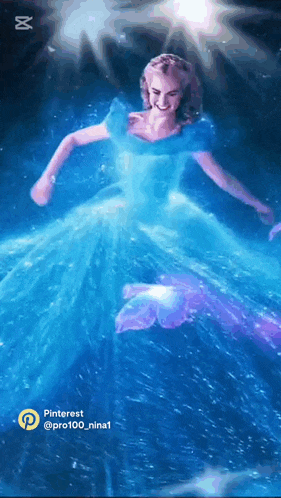 a woman in a blue dress is dancing with a butterfly on her feet