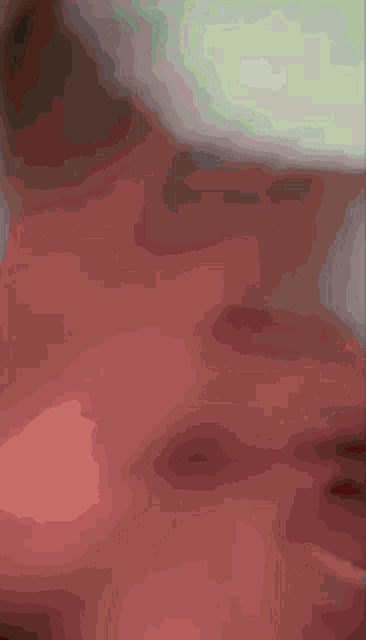 a close up of a person 's mouth with the letter t on the bottom