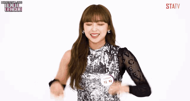 a girl in a sequined top with a name tag that says ' statv ' on it