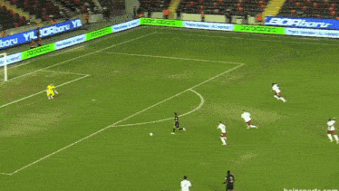a soccer game is being played on a field with advertisements for parolapara