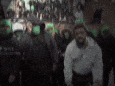 a blurry picture of a group of people wearing masks