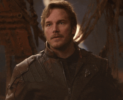 a man with a mustache wearing a leather jacket with a zipper