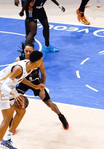 a basketball game is being played on a court with the word ncaa on it