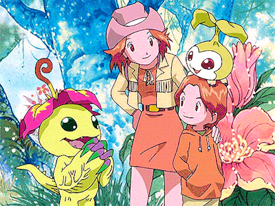 a group of cartoon characters are standing next to each other in a field .