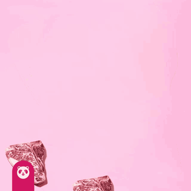 a large piece of meat on a pink background with a panda logo