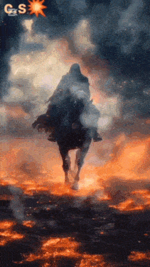 a ghost is riding a horse in the middle of a burning field .