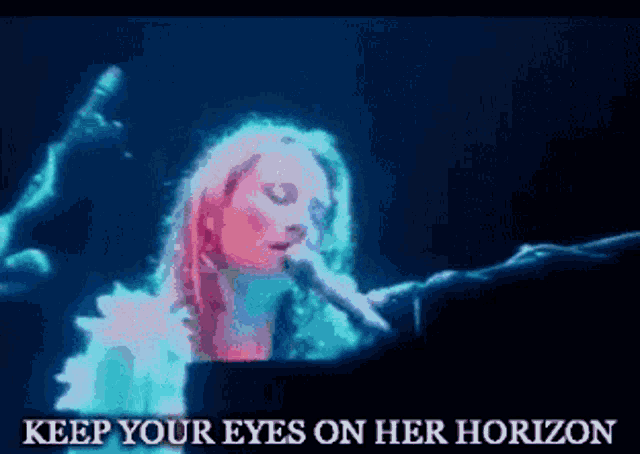 a woman singing into a microphone with the words " keep your eyes on her horizon " below her