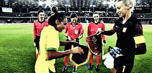 a group of women on a soccer field with the number 7 on the back