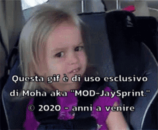 a little girl is sitting in a car seat with the words questa gif e di uso esclusivo di moha