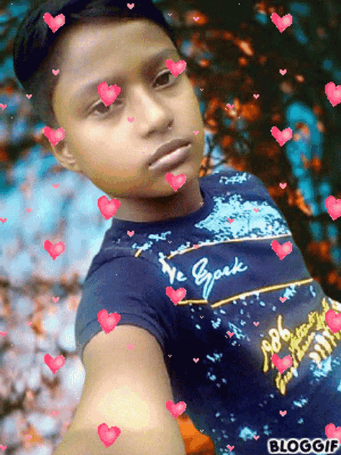 a young boy wearing a shirt that says we spark