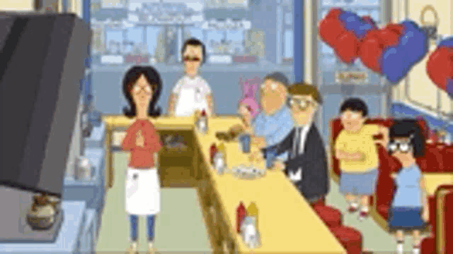 a group of people are standing around a table in a diner with balloons in the background .