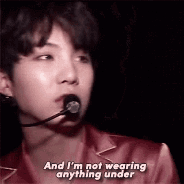 a close up of a person wearing a microphone and saying `` and i 'm not wearing anything under ''
