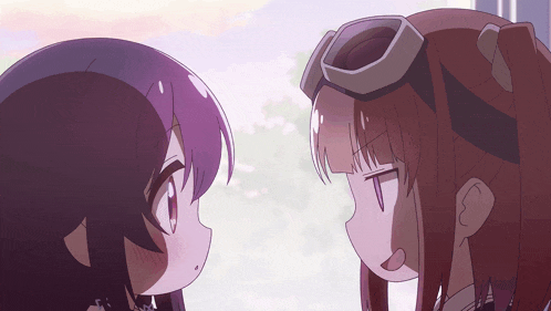 two anime girls are looking at each other and one has goggles on