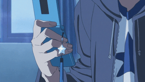 a person in a blue jacket is holding a blue phone with a star on it