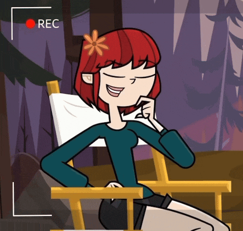 a girl with red hair is sitting in a chair with a red rec button