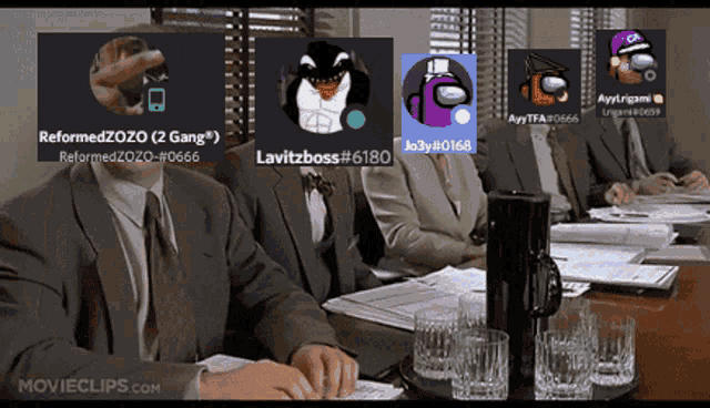 a group of people are sitting at a table with among us avatars on the screen