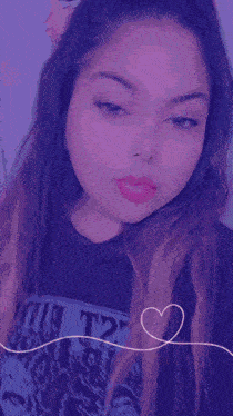 a girl with long hair is wearing a shirt with the number 12 on it