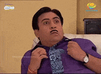 a man wearing a purple shirt and a blue tie