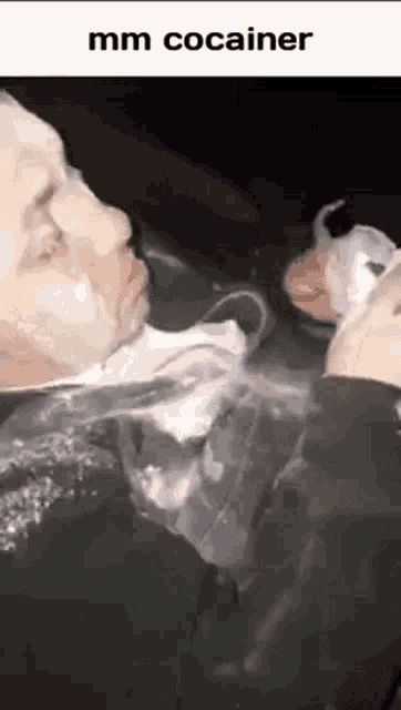a man is shaving his face with a foamy shaving cream in a plastic bag .